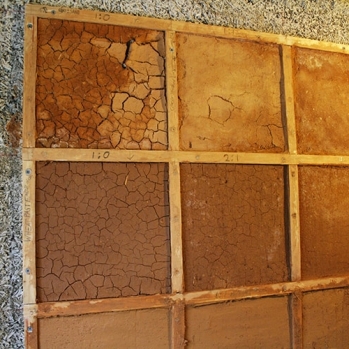 Site-made earthplaster mix tests on hempcrete wall