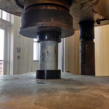 A hydraulic press was used to apply a compressive axial load until failure 