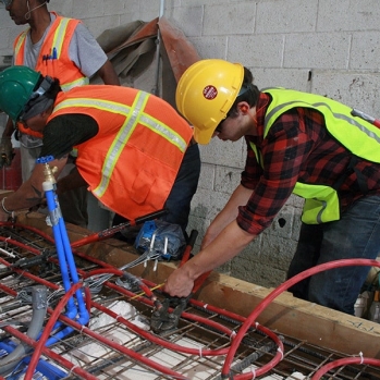 Students and pros working on panel prep