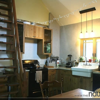 Kitchen with earth-plastered walls made white from purchased Kaolin clay as part of the mix